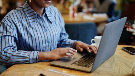 hands on a laptop keyboard